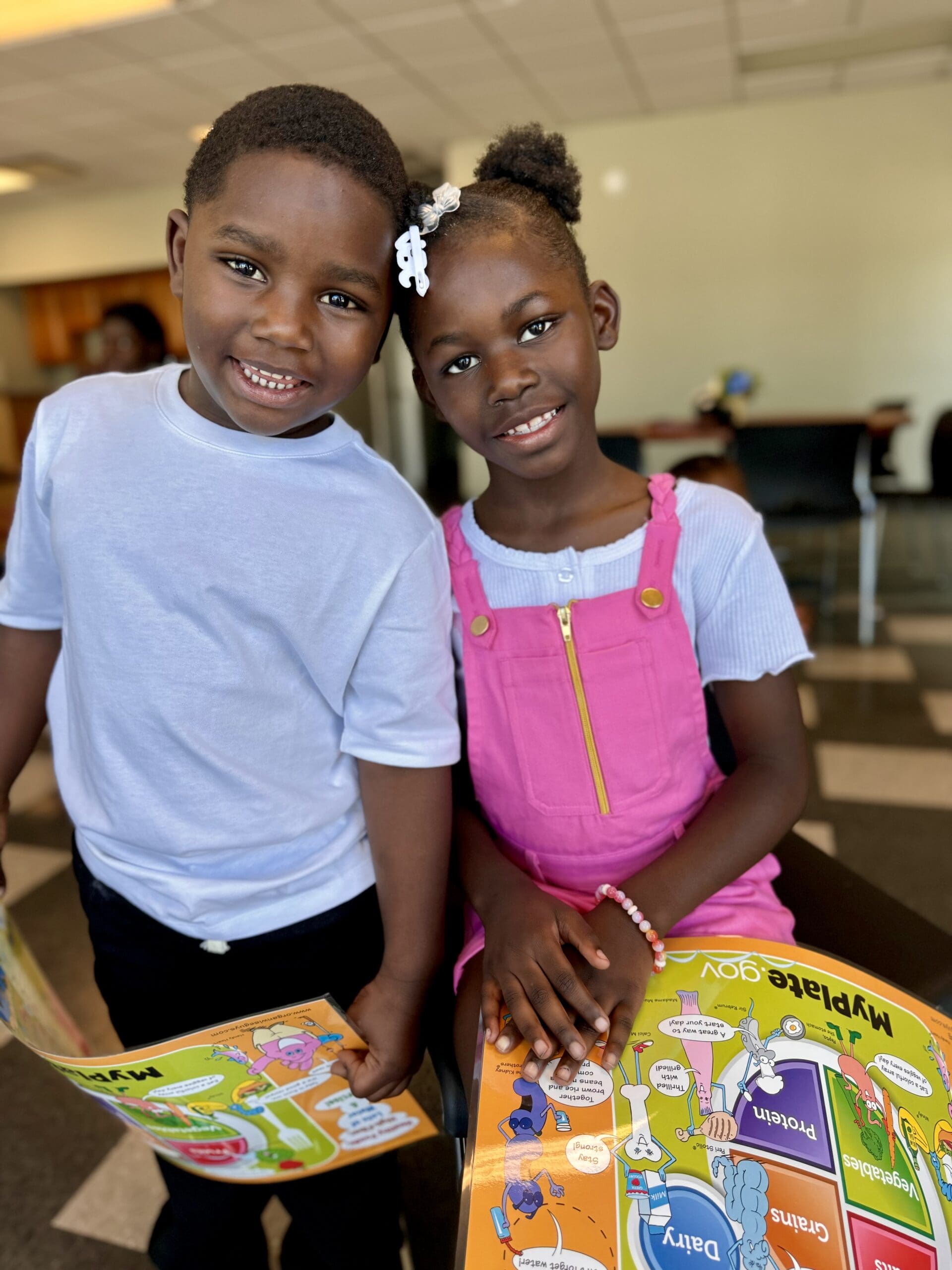 Two children smiling.