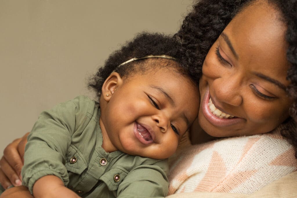 Mother and infant smiling