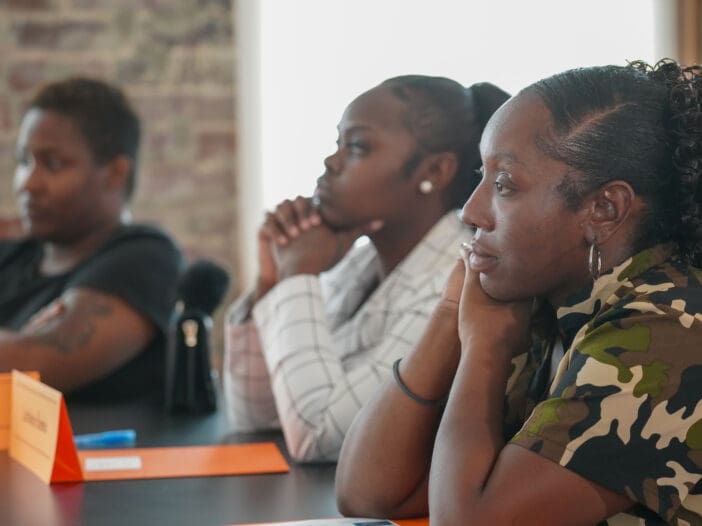 Springboard to Opportunities fellows sitting at a table.